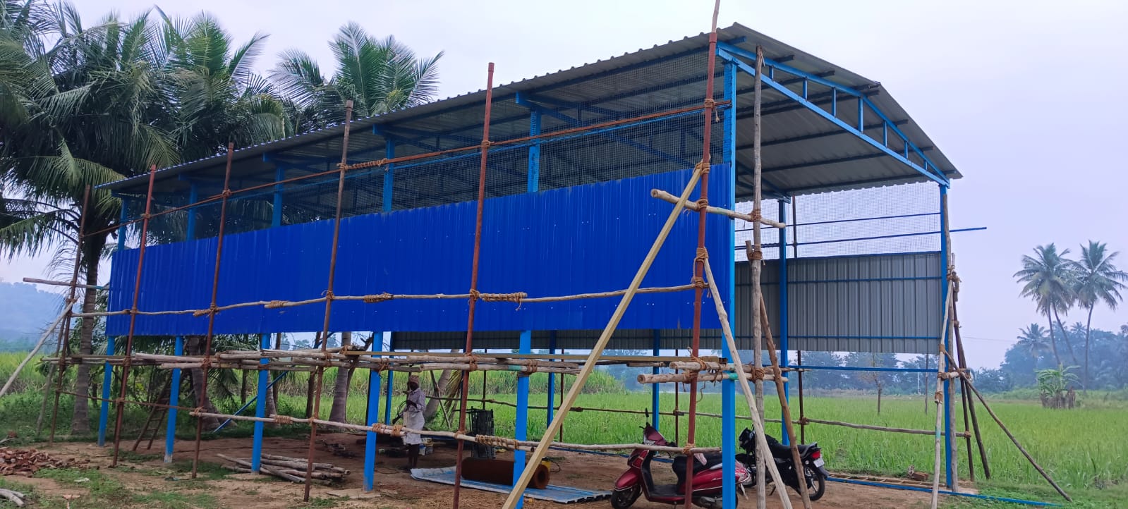 Shed construction exterior view with scaffolding